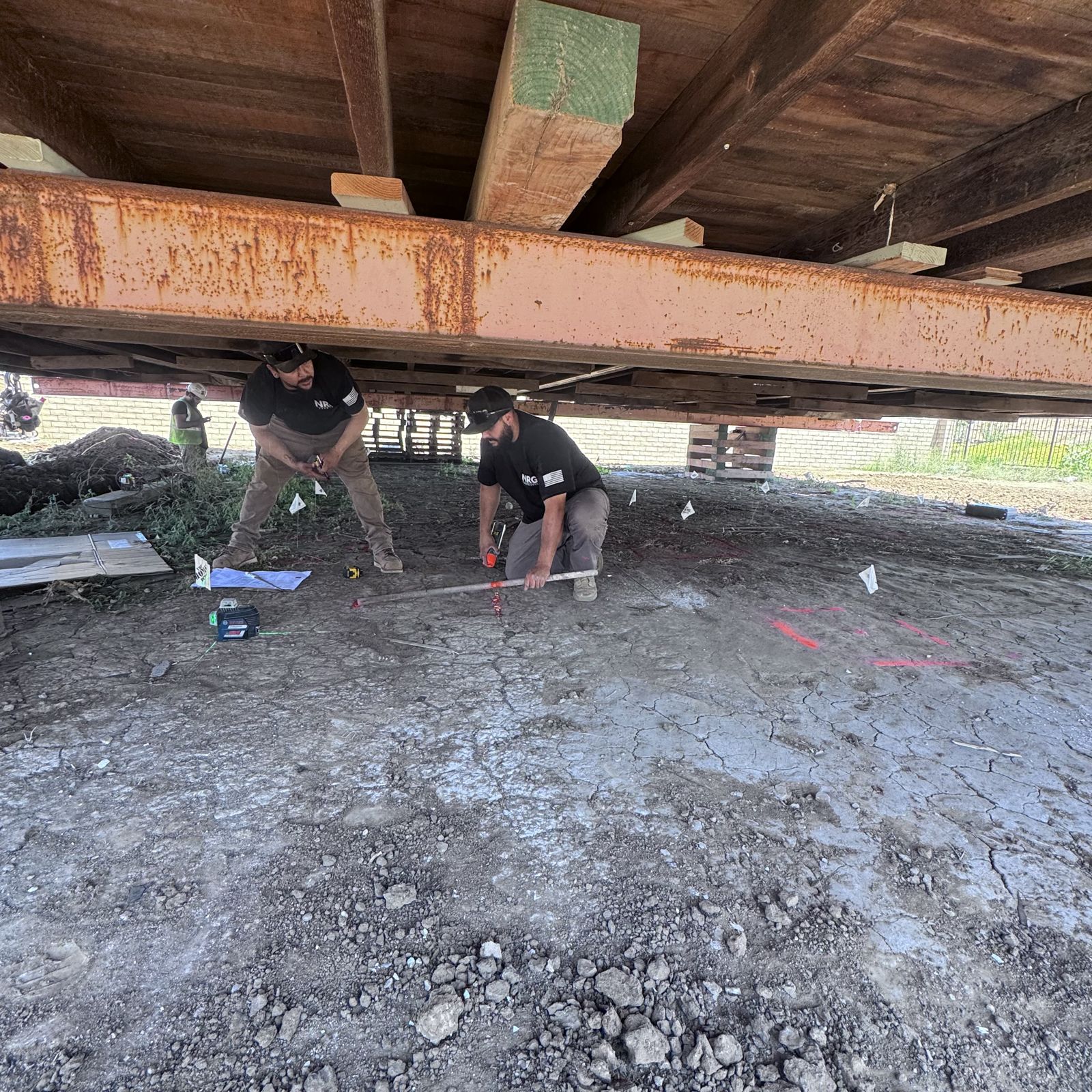 Home raised on steel beams and timber cribbing for a new foundation