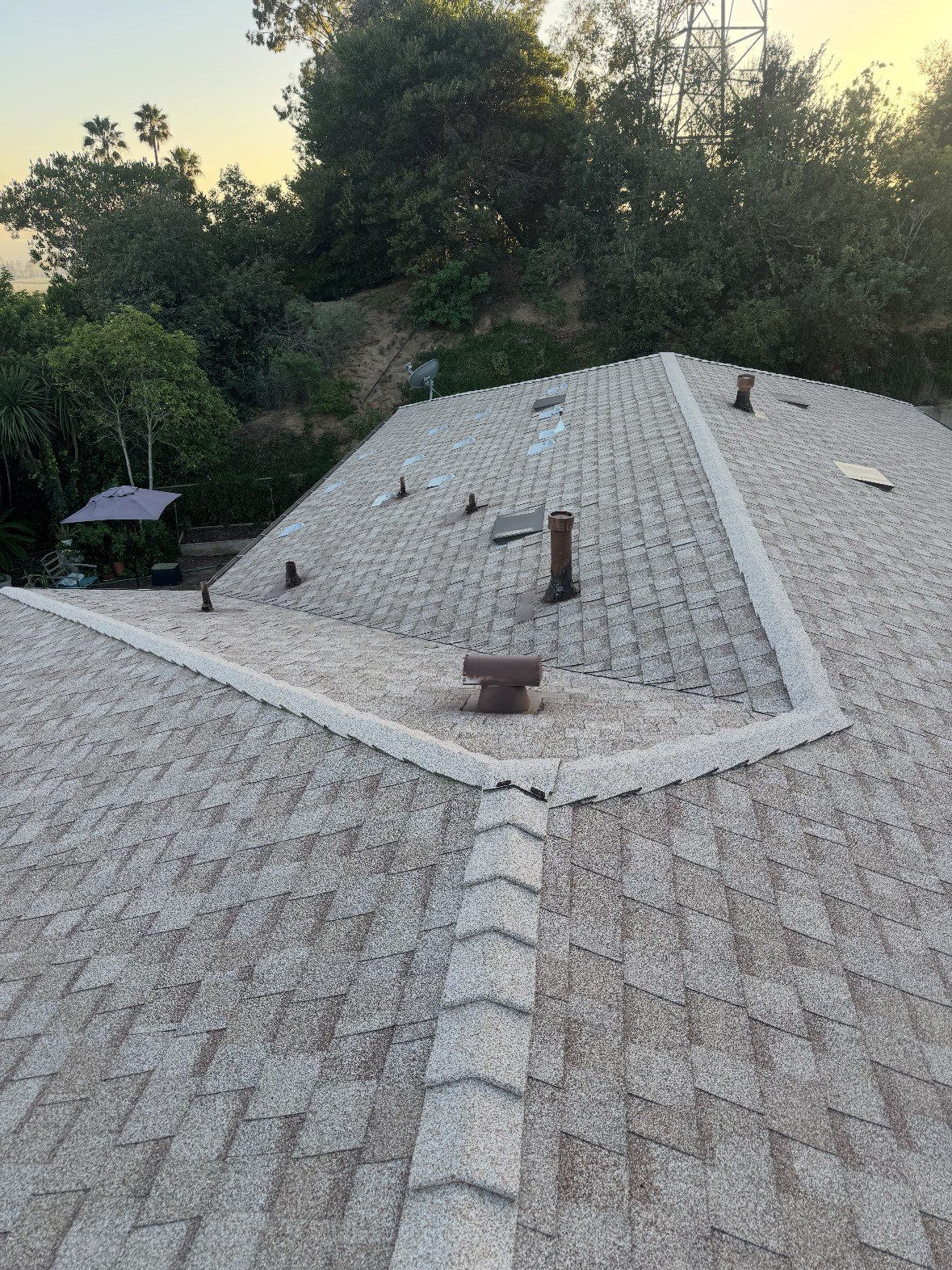 Completed architectural shingle re-roof at sunset in Ventura County