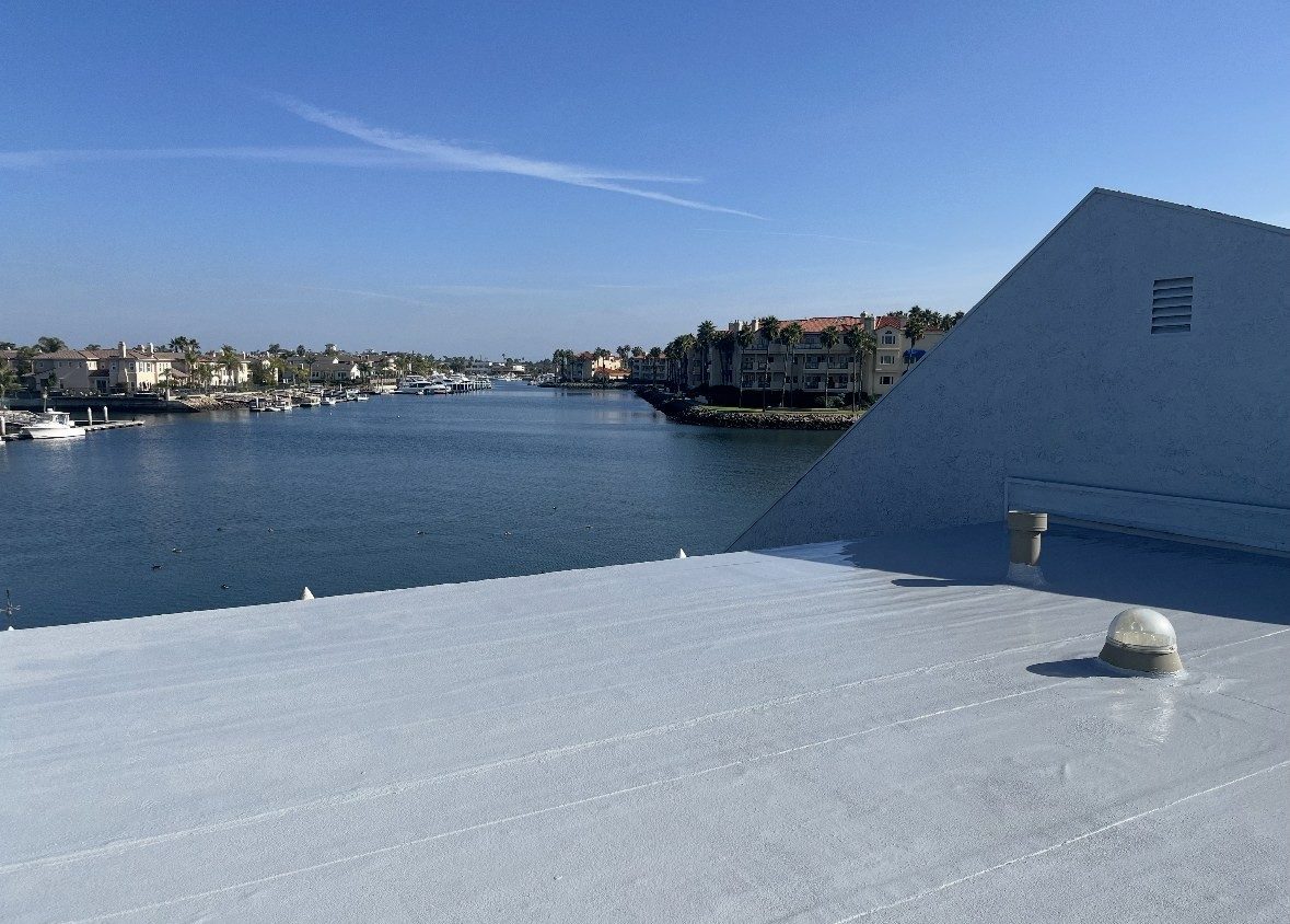 White flat roof system completed on a harbor-front building